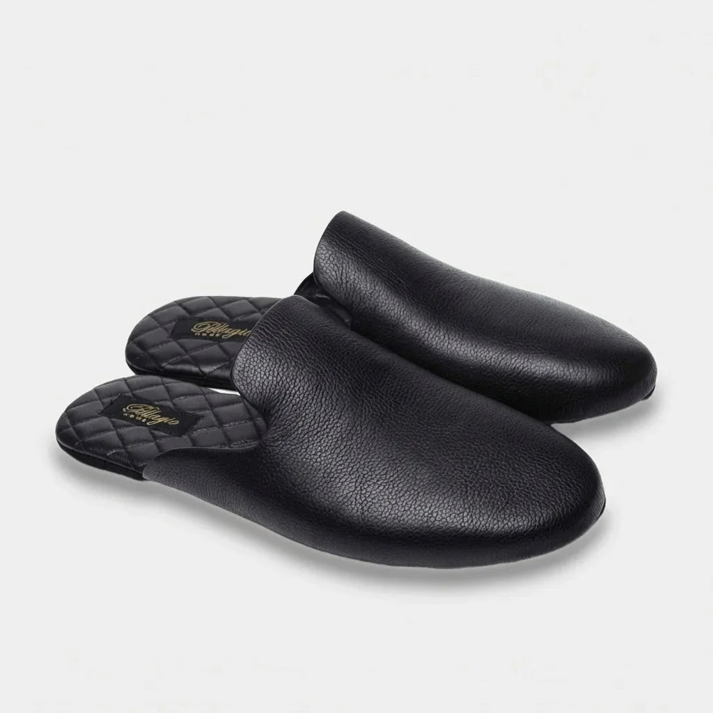 Pair of men's black leather mule slippers, three-quarter view