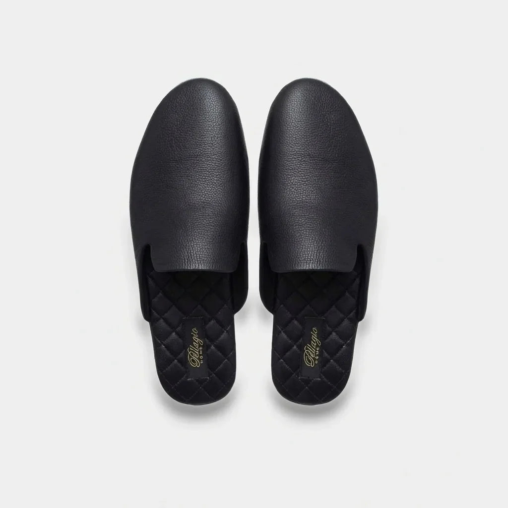 Pair of men's black leather mule slippers from above
