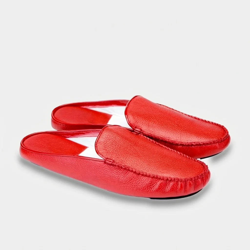 Pair of women's red leather mule slippers, three-quarter view